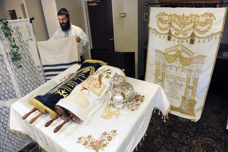 Rabbi Benjy Brackman prepares for altar for the service of Yom Kippur.