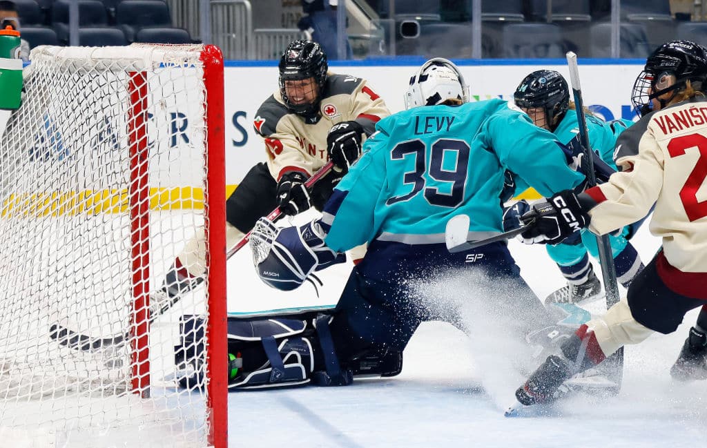 ELMONT, NEW YORK - FEBRUARY 21: Maureen Murphy #15 of Montreal is stopped by Abigail Levy #39 of New York late in the third period at UBS Arena on February 21, 2024 in Elmont, New York. (Photo by Bruce Bennett/Getty Images)