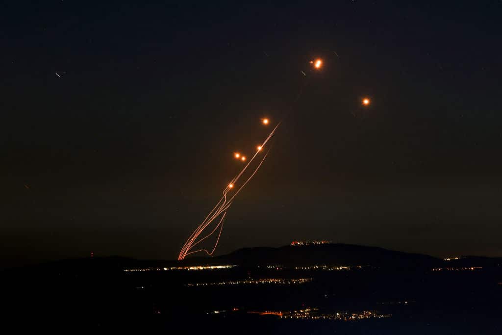 Rockets fired from southern Lebanon are intercepted by Israel's Iron Dome air defence system over the Upper Galilee region in northern Israel on September 27, 2024.