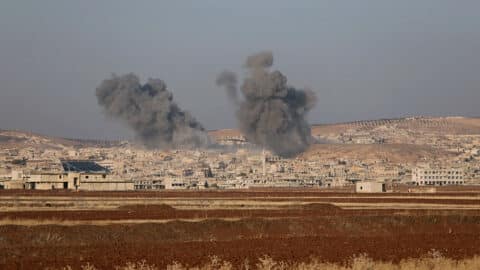 Smoke billows the the Syrian town of Suran, between Aleppo and Hama, on December 3, 2024. Islamist-led rebels advanced on December 3, on Syria's fourth-largest city Hama, buoyed by their lightning capture of swathes of the north in an offensive that ended four years of relative calm. Syrian state media reported that the two air forces had bombed the rebels in their Idlib stronghold as well as their vanguard in Hama province (Photo by Bakr ALKASEM / AFP) (Photo by BAKR ALKASEM/AFP via Getty Images)