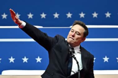 Tesla and SpaceX CEO Elon Musk gestures as he speaks during the inaugural parade inside Capitol One Arena, in Washington, DC, on January 20, 2025. (Photo by ANGELA WEISS / AFP) (Photo by ANGELA WEISS/AFP via Getty Images)