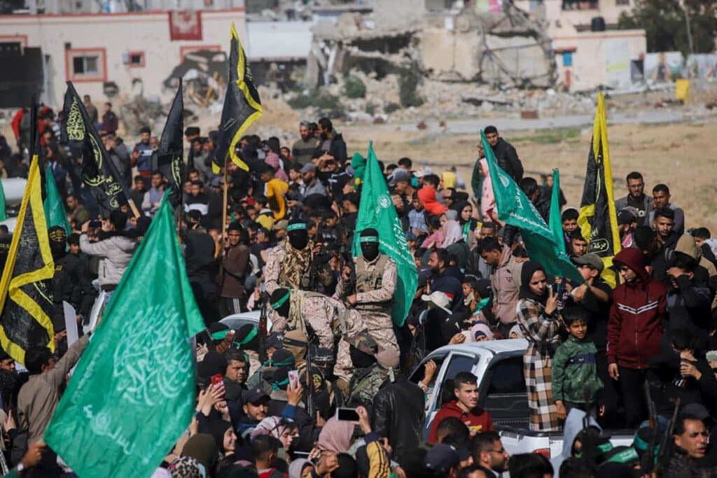 Hamas terrorists arrive in an area before handing over Israeli hostage Agam Berger to a Red Cross team in Jabalia on January 30, 2025, as part of their third hostage-prisoner exchange.