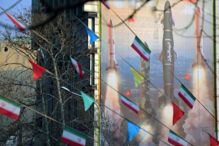 A view of a banner hung on a building reading in Persian and Hebrew 'We are stronger and more motivated than ever. Are you ready for 2 million displaced people?' with pictures of Iranian missiles as tensions between Iran and Israel continue to escalate in Palestine Square of the capital Tehran, Iran.