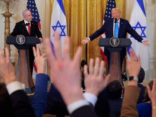 Reporters stand and shout in an attempt to get the attention of U.S. President Donald Trump as he and Israeli Prime Minister Benjamin Netanyahu hold a joint news conference in the East Room of the White House on February 04, 2025 in Washington, DC. Netanyahu is the first foreign leader to visit Trump since he returned to the White House last month.