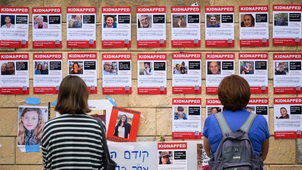 Photographs of some of those taken hostage by Hamas terrorists during their recent attacks are seen on October 18, 2023 in Tel Aviv, Israel. (Photo by Leon Neal/Getty Images)
